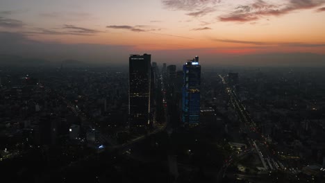 Aerial-view-toward-the-Reforma-high-rise-vibrant-evening-in-downtown-Mexico-city