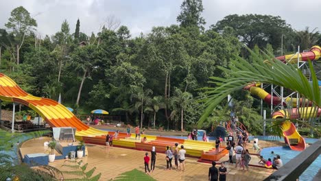 Tourist-enjoying-big-water-slide-ride-at-aqua-park