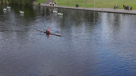 Woman-Female-Rowing-a-Row-Boat-in-the-River-Torrens-Adelaide-South-Australia