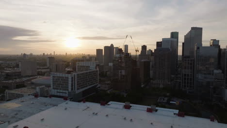 Aerial-view-toward-the-1550-on-the-green-Construction-site,-sunset-in-Houston,-USA