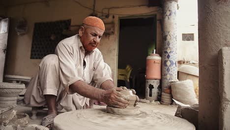 A-old-potter's-hands-expertly-shaping-a-clay