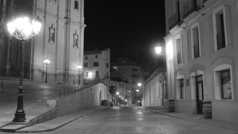 Empty-Streets-At-Night-In-The-Historic-Center-Of-Alcaniz,-Spain---wide,-black-and-white