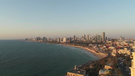 Aerial-view-of-Tel-Aviv-coastline-on-a-beautiful-day-over-The-Mediterranean-Sea