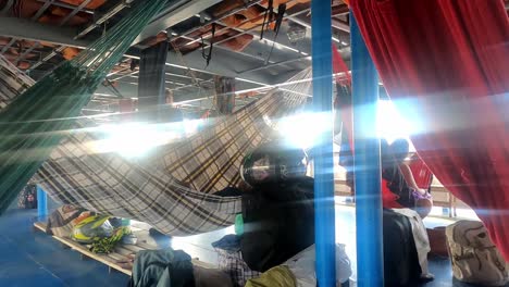 sailing-the-rio-amazonia-amazon-river-in-cargo-boat-people-living-in-hammock