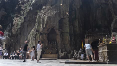 Fast-moving-time-lapse-of-people-inside-cave-at-Marble-Mountains-in-Da-Nang,-Vietnam