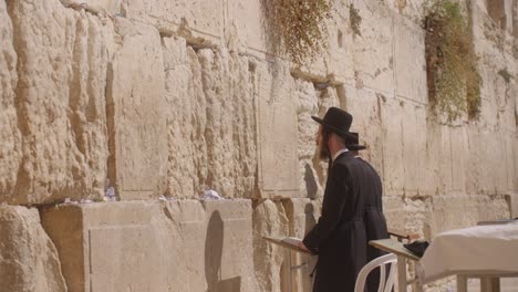a-man-praying-at-Western-Wall,-Jerusalem,-Israel