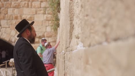 Close-up-on-a-man,-praying-at-Western-Wall,-Jerusalem,-Israel