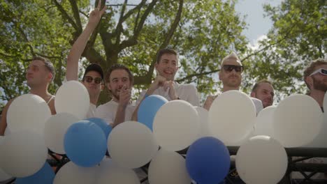 Truck-from-Mister-Gay-Belgium-during-the-Antwerp-Pride-Parade-2023-in-Belgium-with-blue-and-white-balloons