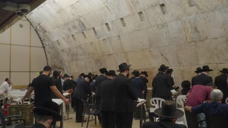 men-reading-torah-and-praying-at-western-wall,-jerusalem,-Israel