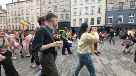 POV-shot-of-walking-into-a-pride-march-along-Edinburgh-Royal-Mile