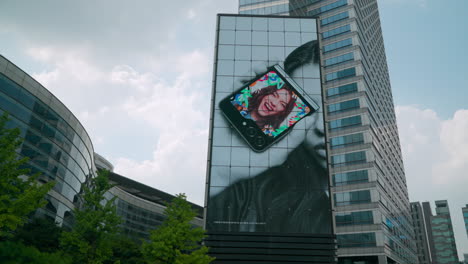 Led-Billboard-On-The-Facade-Of-High-Rise-Buildings-At-Coex-Mall,-Asem-Tower-In-Seoul,-South-Korea