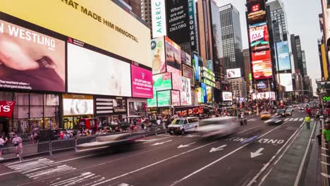 timelapse-with-movement-of-time-square-at-night,-giant-screens-with-advertising,-people,-tourists-and-vehicles-passing-in-downtown-new-york-city