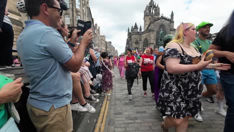 POV-shoto-walking-into-a-vibrant-pride-march-in-Edinburgh-Royal-Mile
