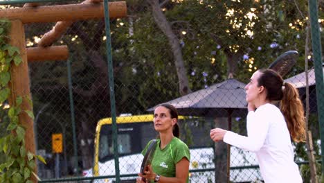 Two-professional-beach-tennis-players-training-beach-tennis-at-sunset-in-Brasilia