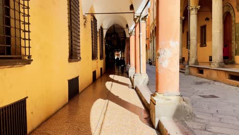 POV-walking-through-the-ornate-streets-of-Bologna,-Italy