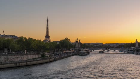 Time-Lapse-of-Paris-Sunset:-Stunning-View-of-Eiffel-Tower-and-Pont-Alexandre-III,-Glistening-Reflections-on-River-Seine,-France