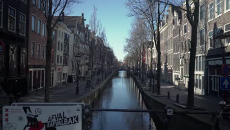 Empty-street-of-famous-red-light-district-De-Wallen-without-people,-city-on-quarantine-due-to-the-outbreak-of-coronavirus-pandemic