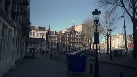 Empty-streets-of-Amsterdam-during-Covid19-crisis,-pandemic-lockdown,-slow-motion-tracking-shot