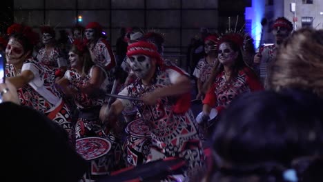 Energetic-drummers-pound-rhythm-for-Day-of-the-Dead-festival,-Mexico