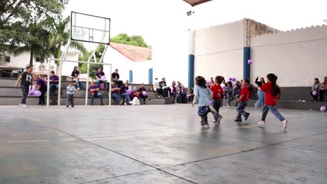Slow-Motion-Shot-Of-Kindergarten-Girls-Trying-To-Score-Goal-In-Their-First-Handball-Tournament,-Paraguay