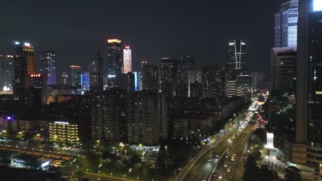 Guangzhou's-living-apartments-block-with-busy-highway-nearby-at-night