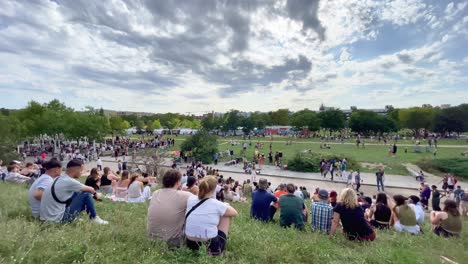 People-Listening-to-Street-Musician-in-Berlin-Mauerpark-on-Lazy-Sunday