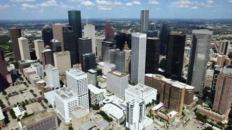 Aerial-view-away-from-the-skyline-of-Houston,-sunny-day-in-Texas,-USA
