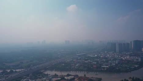 Flying-in-to-Ho-Chi-Minh-City,-Vietnam-on-sunny-morning-with-high-air-pollution