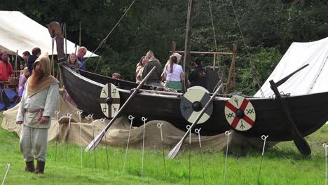 Viking-re-enactment-longboat-and-traditional-dress-man-at-Woodstown-Waterford-Ireland
