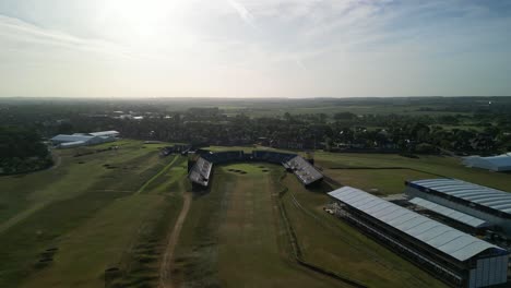 Preparations-for-The-2023-Open-at-Royal-Liverpool-Golf-Club,-Wirral,-UK---Aerial-drone-clubhouse-anti-clockwise-pan,-course-reveal