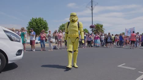 Yellow-stormtrooper-waves-at-the-camera-at-Pride-festival-on-the-Isle-of-white-in-2018