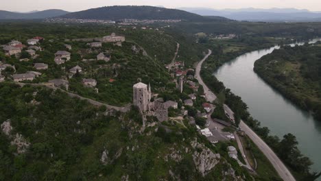 Drone-view-of-the-castle-Kula-above-the-river-Neretva-in-town-Pocitelj,-View-of-the-town-inside-the-castle-from-above