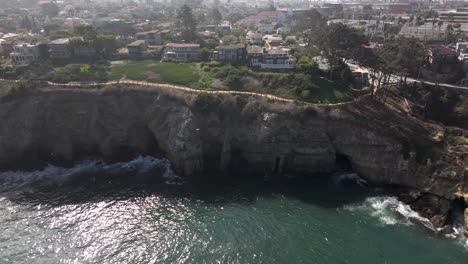 Aerial-over-La-Jolla-Cove-and-neighborhood-of-high-end-homes-with-ocean-front-views