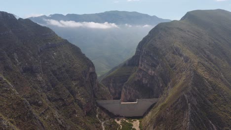 Wide,-high-aerial-view-of-dam-for-flood-and-erosion-control-in-mountains-of-Nuevo-Leon,-Mexico-near-Monterrey