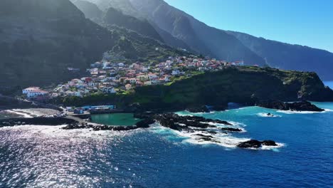 Glistening-ocean-water-of-Seixal-natural-pools,-Madeira-Portugal,-aerial-establish