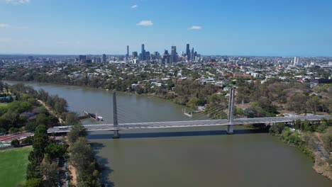 Eleanor-Schonell-Bridge-Spanning-Brisbane-River,-Backdropped-By-Brisbane-Skyline