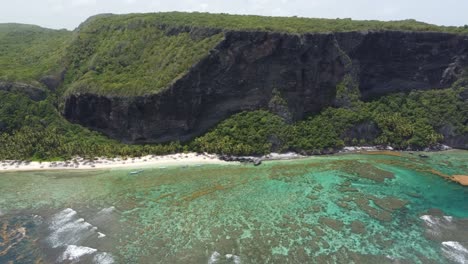 Aerial-view-of-the-steep-cliff-at-Playa-Frontón-beach-near-Las-Galeras-on-the-Samaná-peninsula-in-the-Dominican-Republic