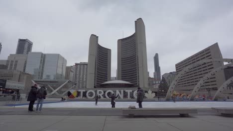 People-Posing-For-Photos-At-City-Hall,-Toronto