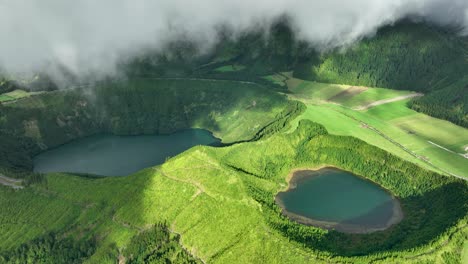 Drone-view-near-clouds-of-scenic-Rasa---and-Santiago-lagoons-at-Sete-Cidades