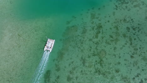 Aerial-drone-view-of-Catamaran-sailing-on-tropical-turquoise-ocean