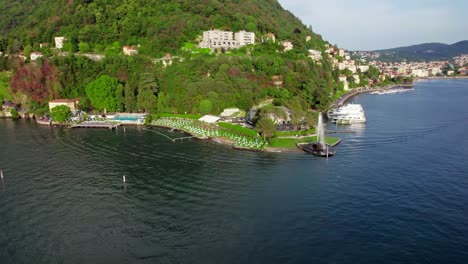 Wide-orbit-aerial-Lake-Como-fountain-alfresco-lakeside-restaurant,-Italy