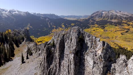 Drone-flys-down-rock-spine-on-Ruby-Peak-looking-at-Marcellina-Mountain-and-Anthracite-Range-Colorado