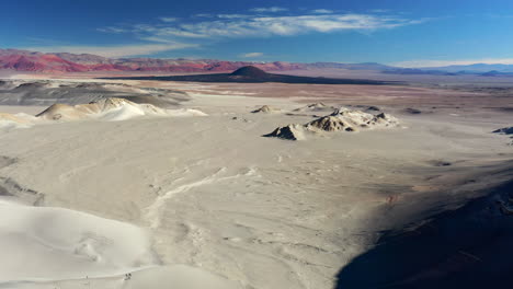 Aerial-Drone-Spectacular-Landscape-Volcano-Dune-Ocher-Mountains-Carachi-Pampa-Catamarca-Argentina-Blue-Sky