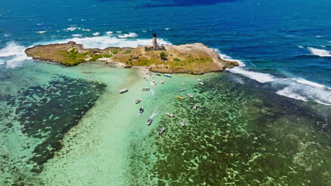 Aerial-drone-view-of-a-lighthouse-on-Ile-aux-Fouquets,-Ile-au-Phare,-Bois-des-Amourettes,-Mauritius