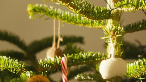 Close-up-of-festive-Christmas-tree-with-handmade-ornaments