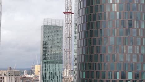Modern-architecture-of-Deansgate-Square-luxury-residential-towers,-aerial-riser