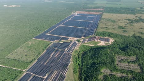 Vast-exotic-countryside-panorama-with-big-photovoltaic-power-plant,-aerial