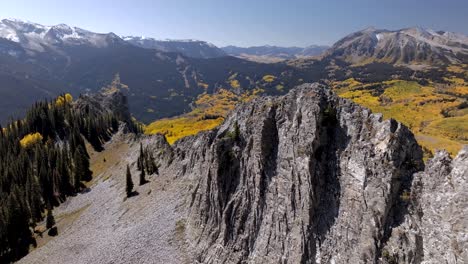 Drone-flys-around-rocky-spine-on-Ruby-Peak-looking-at-Marcellina-Mountain-and-Anthracite-Range-Colorado
