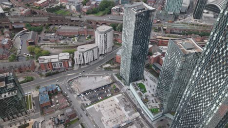 Aerial-pullback-view-of-Deansgate-Square-apartment-complex-in-Manchester,-UK