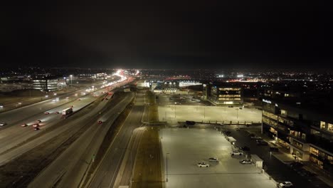 Aerial-hyper-lapse-of-traffic-along-a-highway-at-nighttime